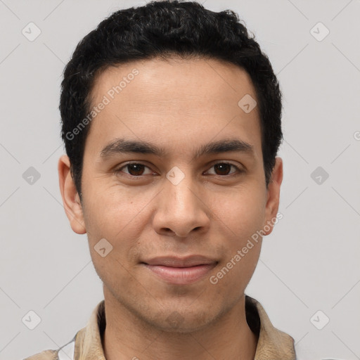 Joyful latino young-adult male with short  brown hair and brown eyes