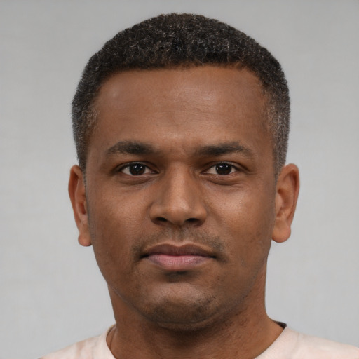 Neutral latino young-adult male with short  brown hair and brown eyes