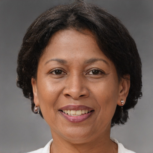Joyful black adult female with short  brown hair and brown eyes