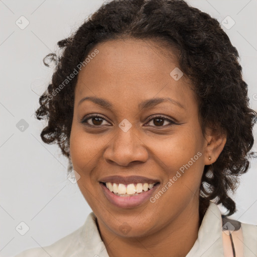 Joyful black young-adult female with medium  brown hair and brown eyes