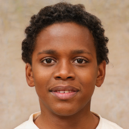 Joyful black young-adult male with short  brown hair and brown eyes