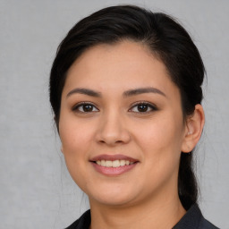 Joyful white young-adult female with medium  brown hair and brown eyes