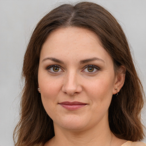 Joyful white young-adult female with medium  brown hair and brown eyes