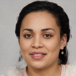 Joyful latino young-adult female with medium  brown hair and brown eyes