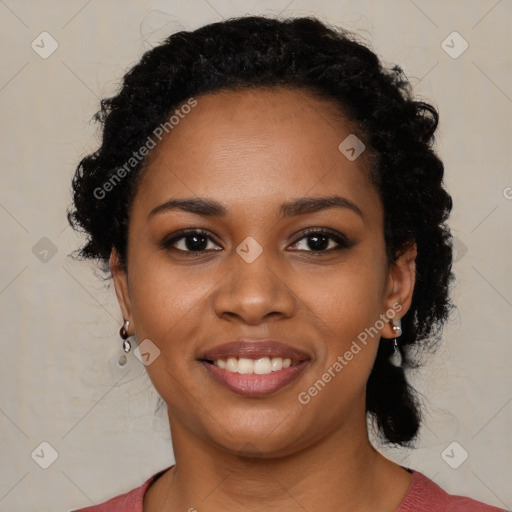 Joyful black young-adult female with long  black hair and brown eyes