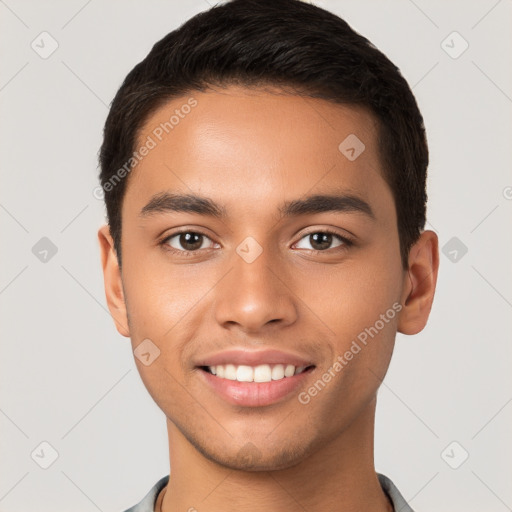 Joyful latino young-adult male with short  brown hair and brown eyes