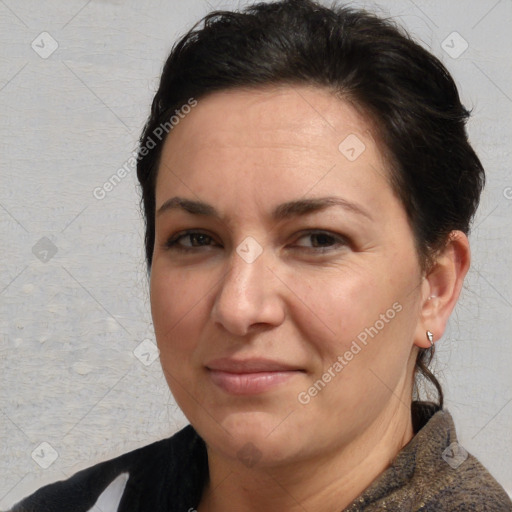 Joyful white adult female with short  brown hair and brown eyes