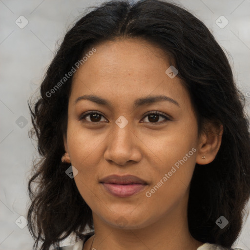 Joyful latino young-adult female with long  brown hair and brown eyes