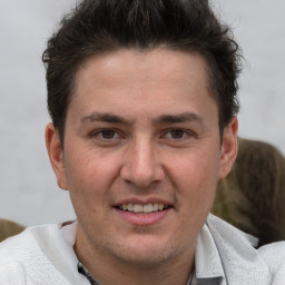 Joyful white adult male with short  brown hair and brown eyes