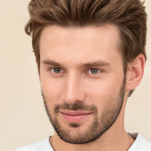 Joyful white young-adult male with short  brown hair and brown eyes