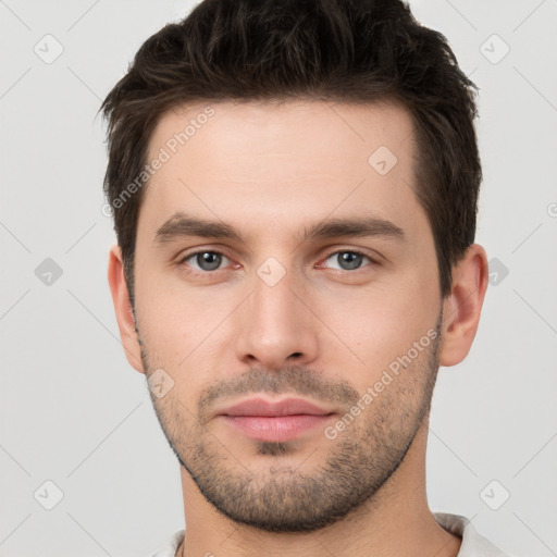 Neutral white young-adult male with short  brown hair and brown eyes