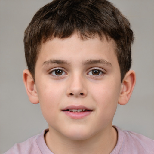 Joyful white child male with short  brown hair and brown eyes