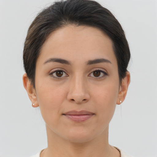 Joyful asian young-adult female with short  brown hair and brown eyes