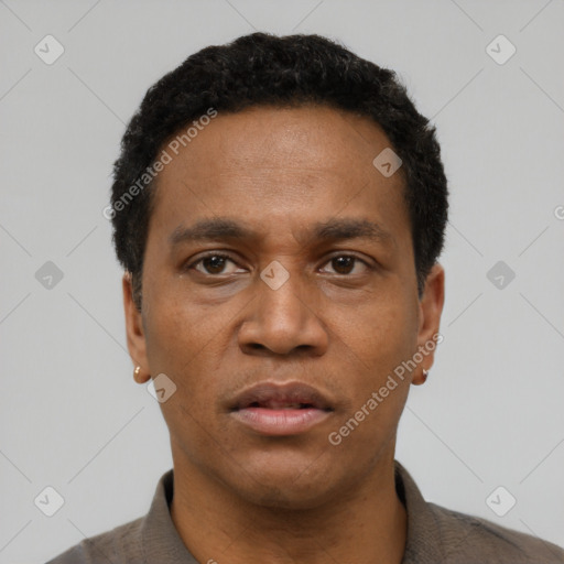 Neutral latino adult male with short  black hair and brown eyes