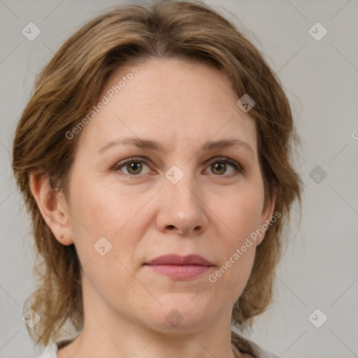 Joyful white adult female with medium  brown hair and green eyes