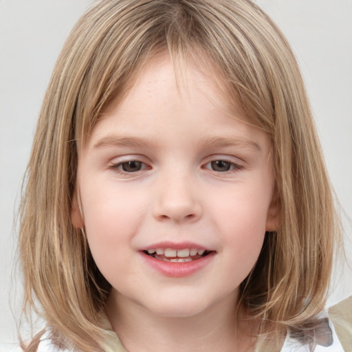 Joyful white child female with medium  brown hair and grey eyes