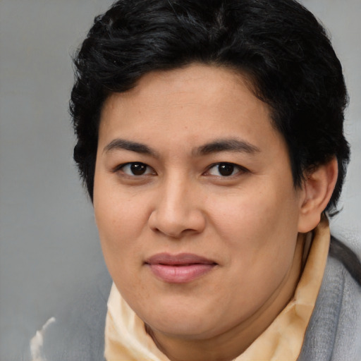 Joyful latino adult female with short  brown hair and brown eyes