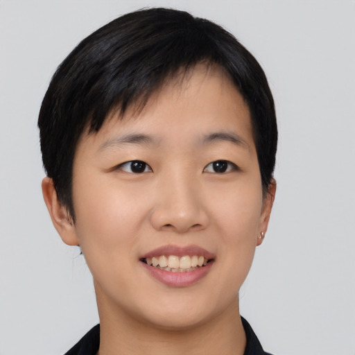 Joyful asian young-adult female with short  black hair and brown eyes