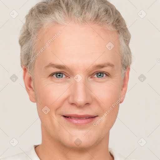 Joyful white adult male with short  brown hair and grey eyes