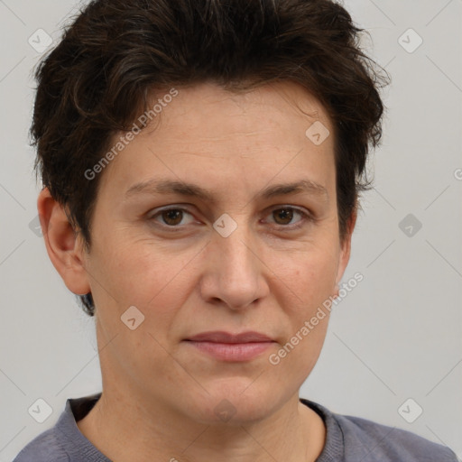 Joyful white adult female with short  brown hair and brown eyes