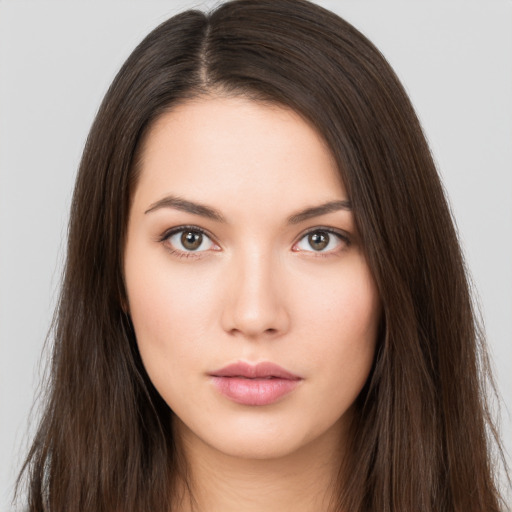 Neutral white young-adult female with long  brown hair and brown eyes