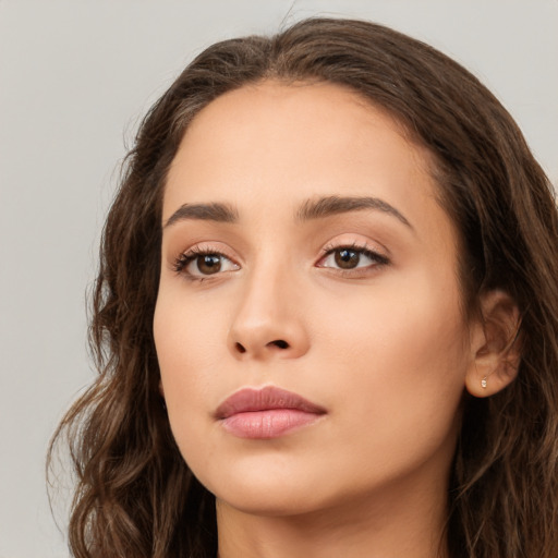 Neutral white young-adult female with long  brown hair and brown eyes