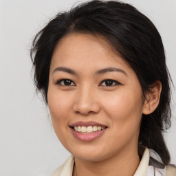 Joyful asian young-adult female with medium  brown hair and brown eyes