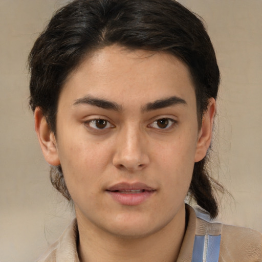 Joyful latino young-adult male with medium  brown hair and brown eyes