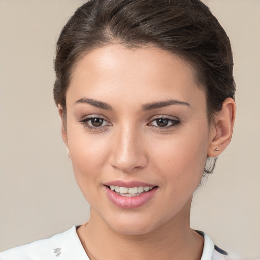 Joyful white young-adult female with short  brown hair and brown eyes