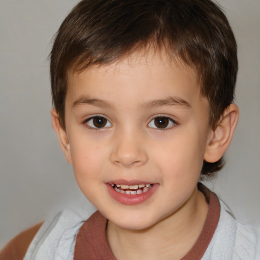 Joyful white child male with short  brown hair and brown eyes