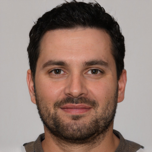 Neutral white young-adult male with short  black hair and brown eyes