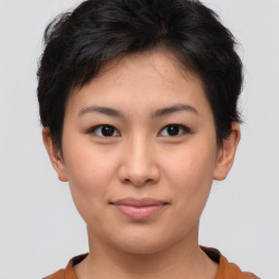 Joyful asian young-adult female with short  brown hair and brown eyes