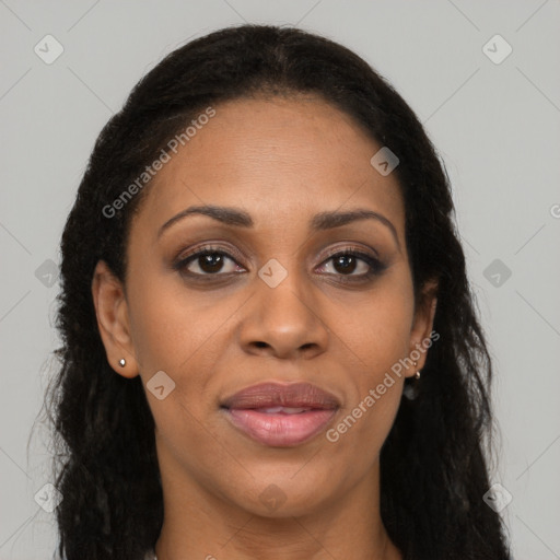 Joyful black adult female with long  brown hair and brown eyes