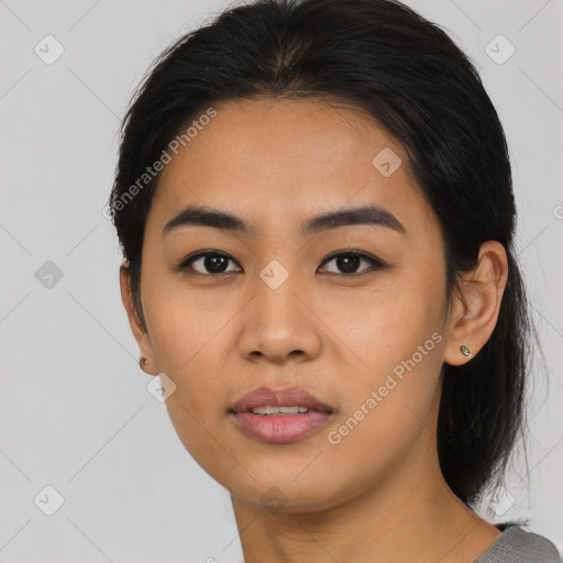 Joyful asian young-adult female with long  black hair and brown eyes