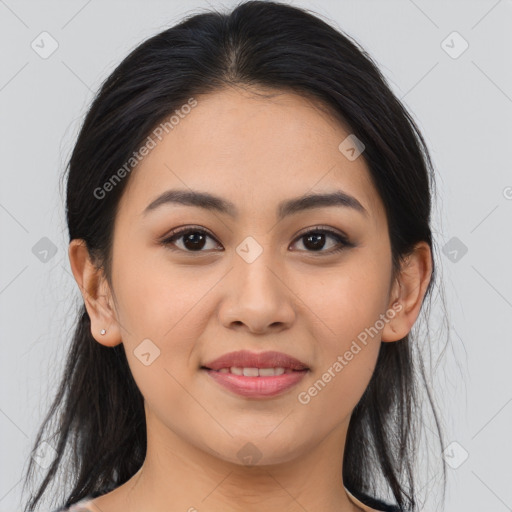 Joyful asian young-adult female with long  brown hair and brown eyes