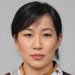 Neutral asian young-adult female with medium  brown hair and brown eyes