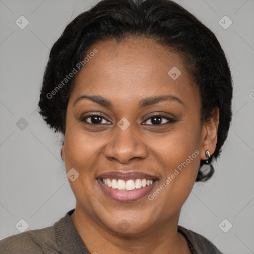 Joyful latino young-adult female with short  brown hair and brown eyes