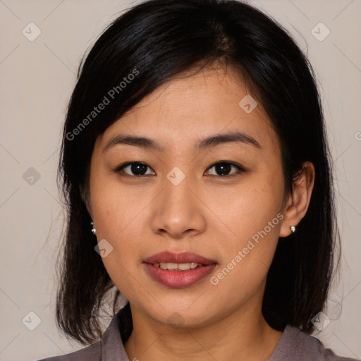 Joyful asian young-adult female with medium  brown hair and brown eyes