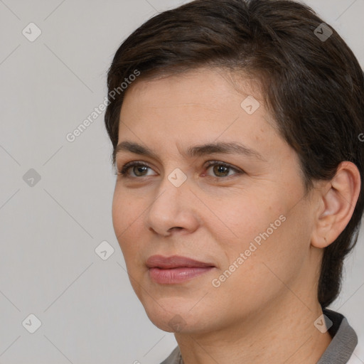 Joyful white adult female with short  brown hair and brown eyes