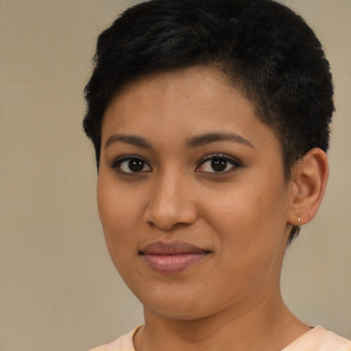 Joyful latino young-adult female with short  brown hair and brown eyes