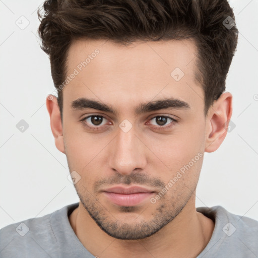 Neutral white young-adult male with short  brown hair and brown eyes