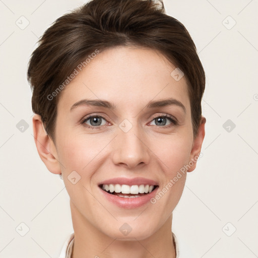 Joyful white young-adult female with short  brown hair and grey eyes