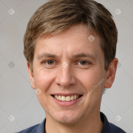 Joyful white adult male with short  brown hair and grey eyes