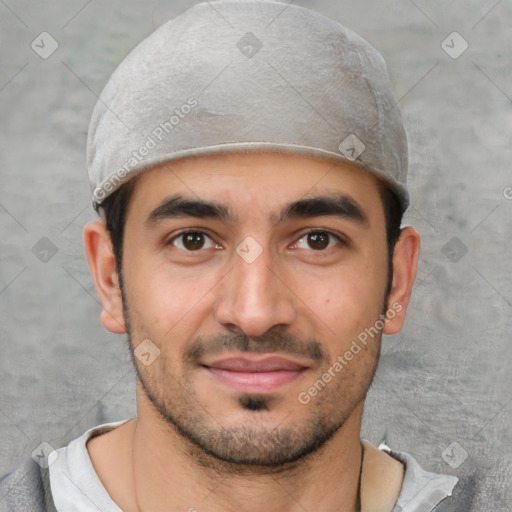 Joyful white young-adult male with short  black hair and brown eyes