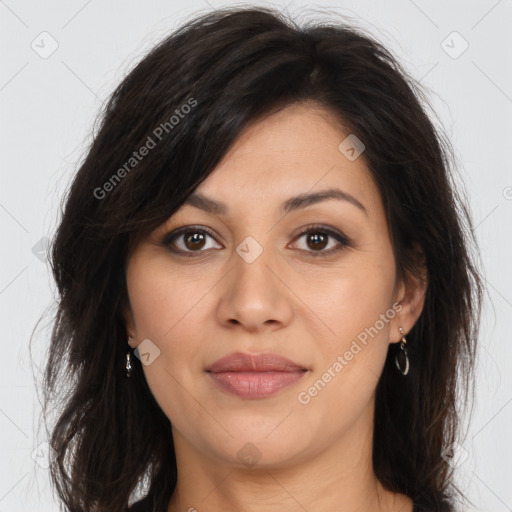 Joyful latino young-adult female with long  brown hair and brown eyes