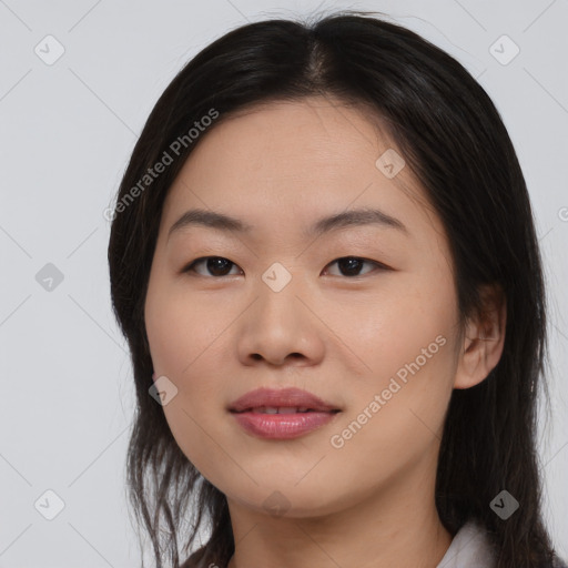 Joyful asian young-adult female with medium  black hair and brown eyes