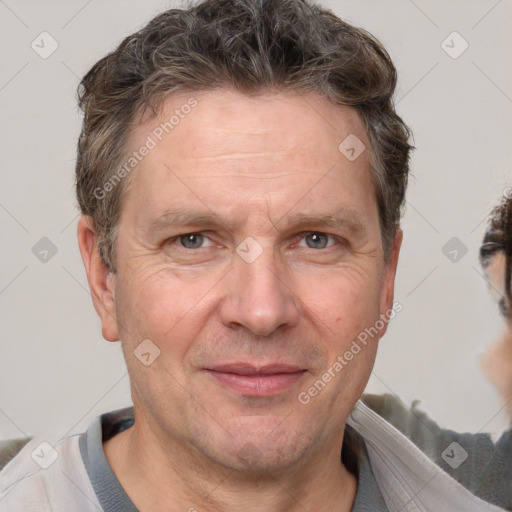 Joyful white adult male with short  brown hair and grey eyes