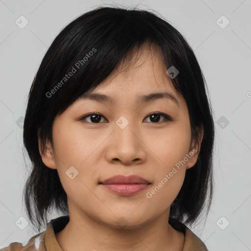 Joyful asian young-adult female with medium  black hair and brown eyes