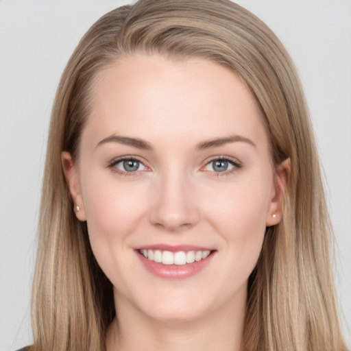 Joyful white young-adult female with long  brown hair and grey eyes