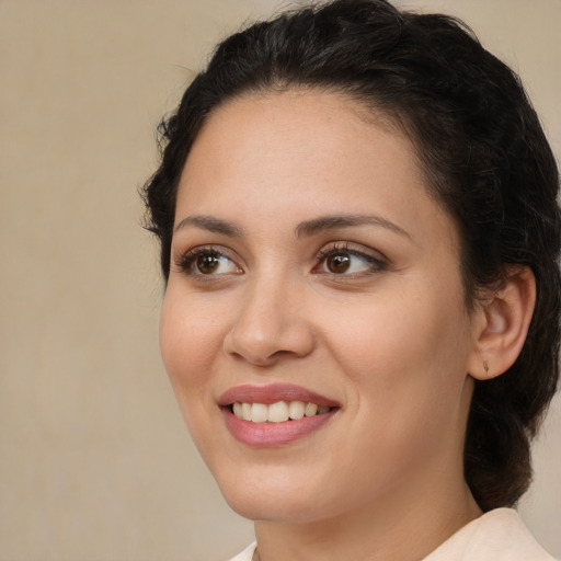Joyful white young-adult female with medium  brown hair and brown eyes
